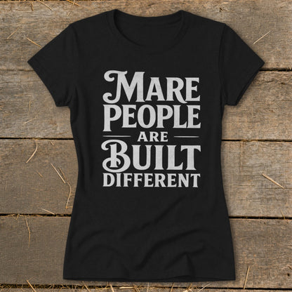 Black t-shirt with white text: "Mare People Are Built Different"