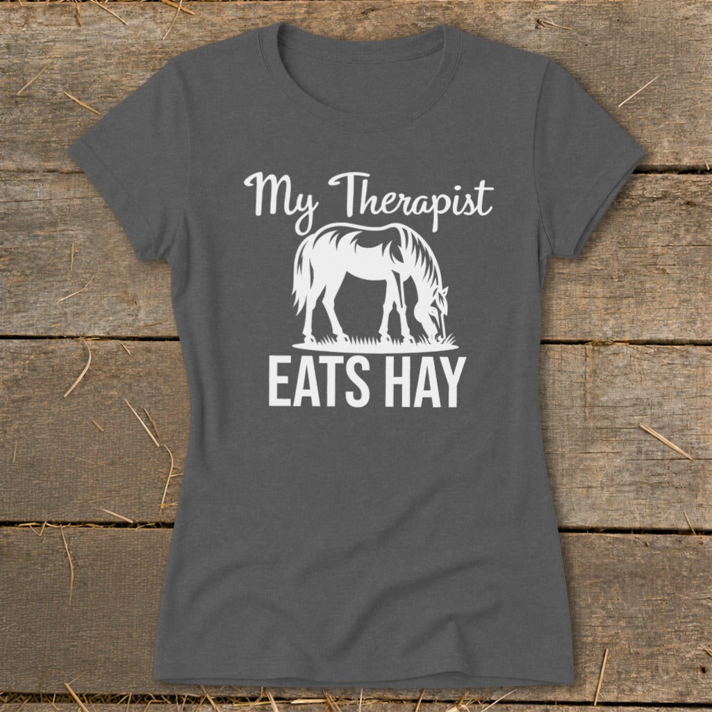 Dark grey t-shirt with white text and horse graphic that reads "My Therapist EATS HAY".