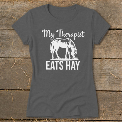 Dark grey t-shirt with white text and horse graphic that reads "My Therapist EATS HAY".