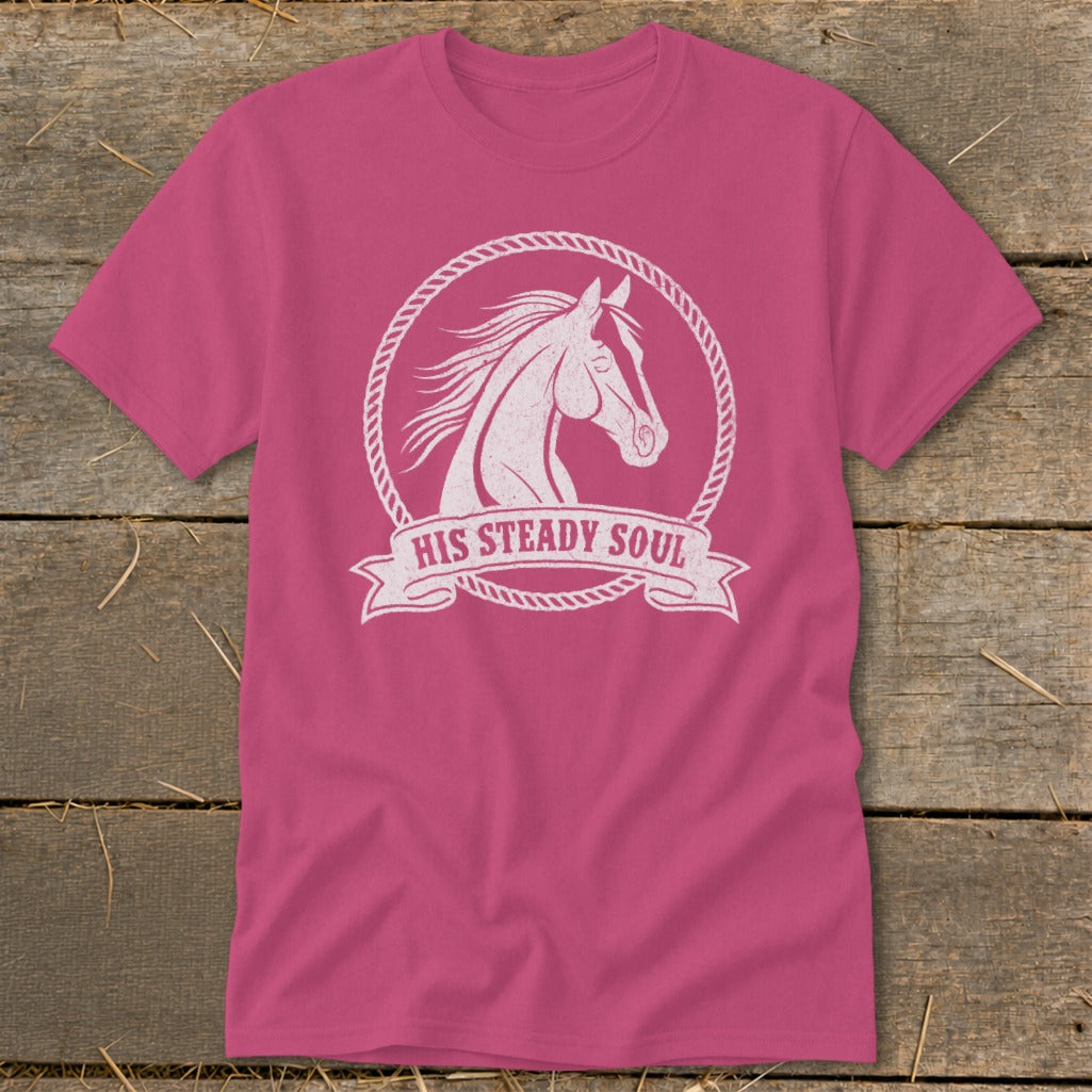 Pink t-shirt with white distressed horse graphic inside rope circle and banner that says "HIS STEADY SOUL".