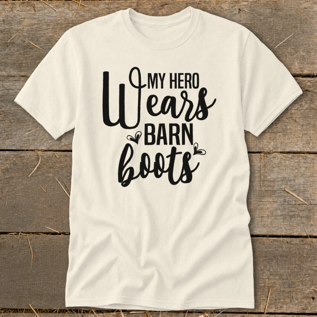 Cream t-shirt with "My Hero Wears Barn Boots" text in black script.