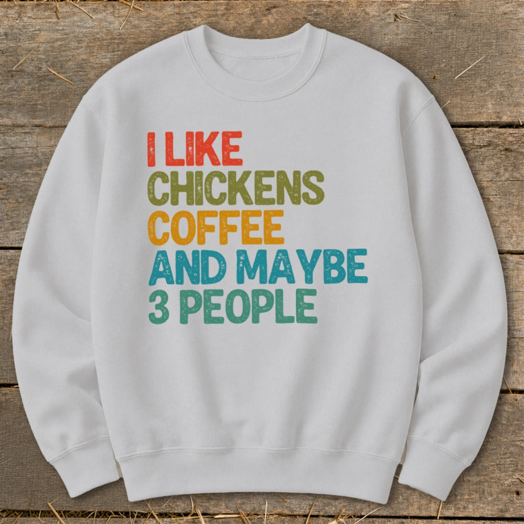 White sweatshirt with text "I LIKE CHICKENS COFFEE AND MAYBE 3 PEOPLE".