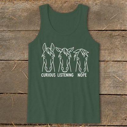A dark green tank top featuring a white graphic of three horse heads with the text "CURIOUS," "LISTENING," and "NOPE."