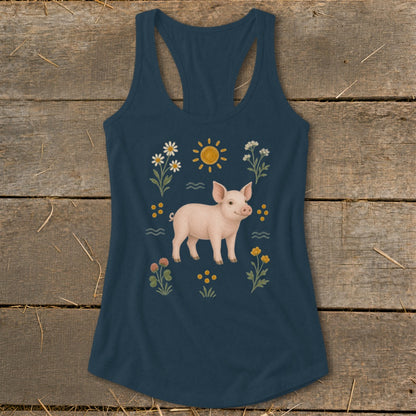 Navy tank top with a pink pig surrounded by flowers and a sun graphic.