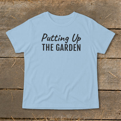 Light blue t-shirt with black text "Putting Up THE GARDEN"