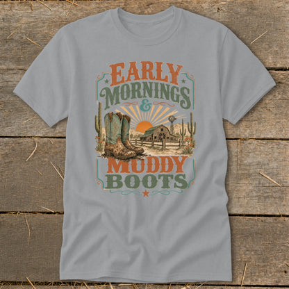 T-shirt graphic with cowboy boots, barn, cacti, and text "Early Mornings & Muddy Boots".