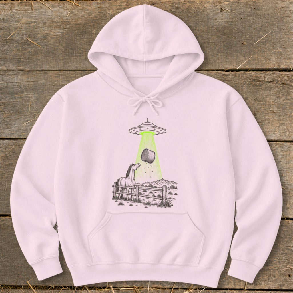 Hoodie with a drawing of a horse and hay bale being abducted by a UFO.