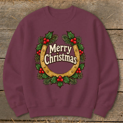 Burgundy sweatshirt with a Christmas horseshoe and holly wreath graphic.