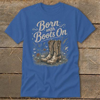 Blue t-shirt with "Born with Boots On" text and cowboy boots in flowers.