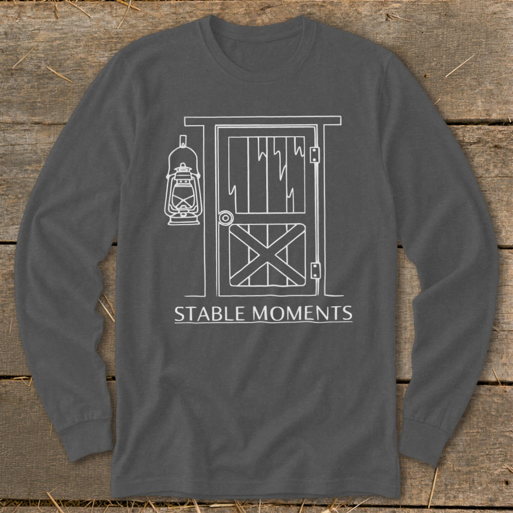 Long-sleeved gray shirt with white line drawing of a stable door, lantern, and "STABLE MOMENTS" text.