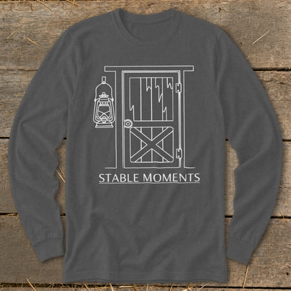 Long-sleeved gray shirt with white line drawing of a stable door, lantern, and "STABLE MOMENTS" text.