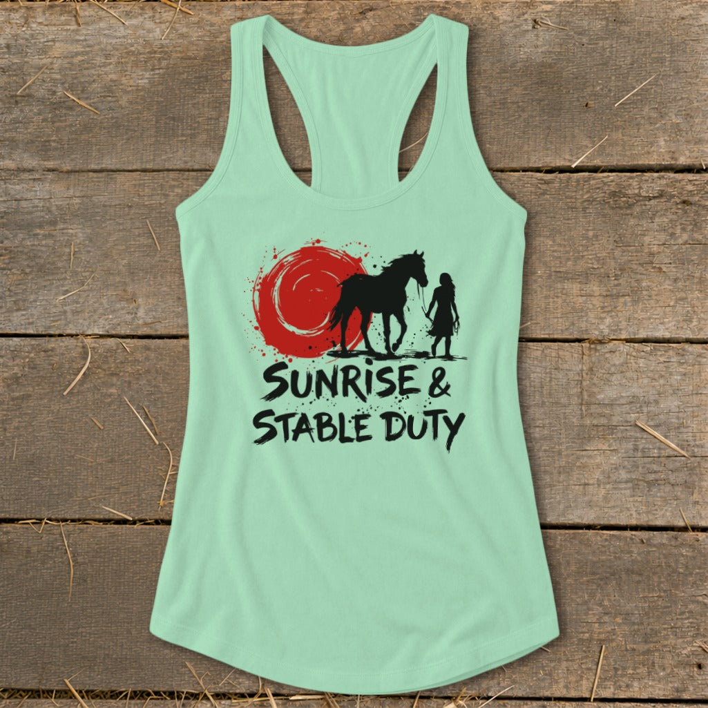 Mint green tank top with graphic of horse, person, and red sun. Text reads "Sunrise & Stable Duty".