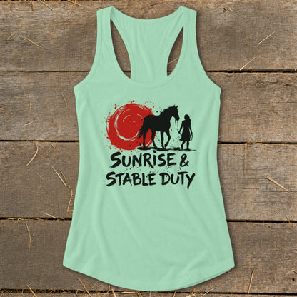 Mint green tank top with graphic of horse, person, and red sun. Text reads "Sunrise & Stable Duty".