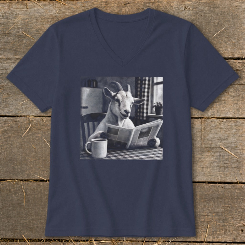 A navy blue V-neck t-shirt featuring a graphic of a goat reading a newspaper at a table with a mug.