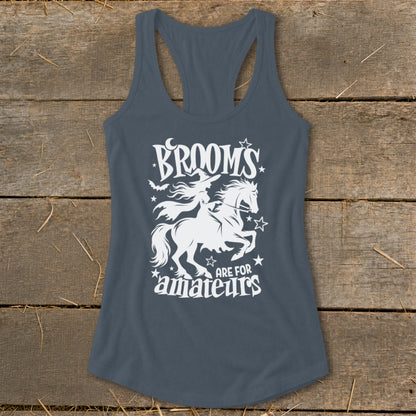 White graphic of a witch on a horse with text "Brooms are for amateurs"