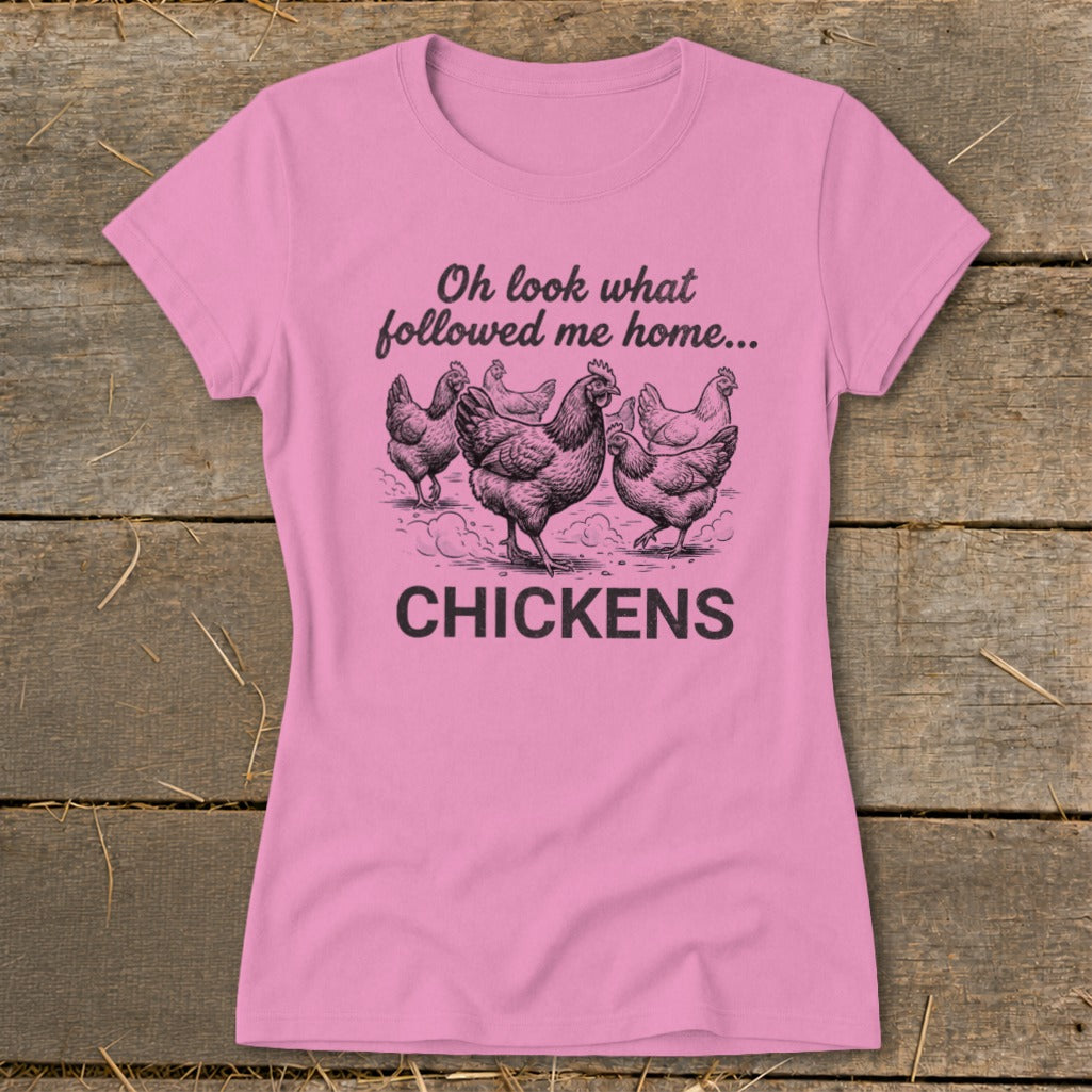 Pink t-shirt with illustration of chickens and text "Oh look what followed me home... CHICKENS".