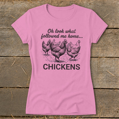 Pink t-shirt with illustration of chickens and text "Oh look what followed me home... CHICKENS".