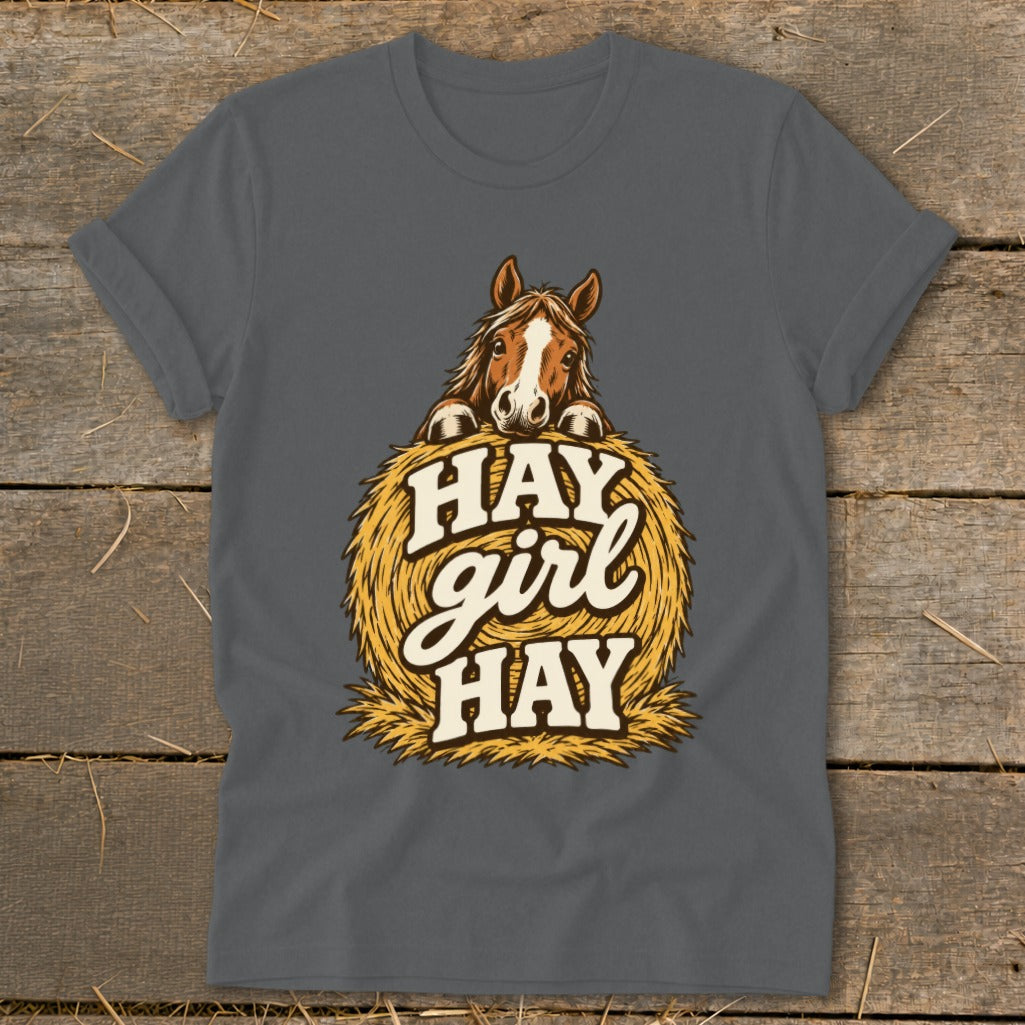 Horse peeking over hay bale with "Hay girl Hay" text.