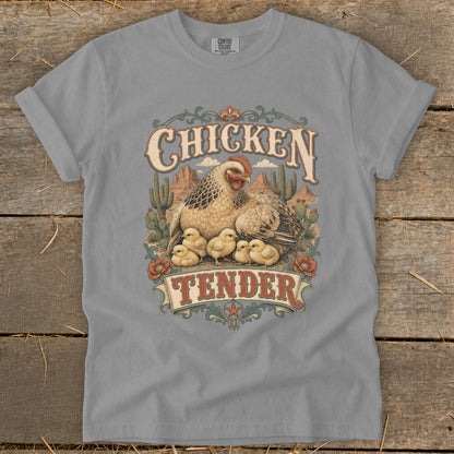 T-shirt graphic with chickens and chicks in desert landscape, reading "Chicken Tender."