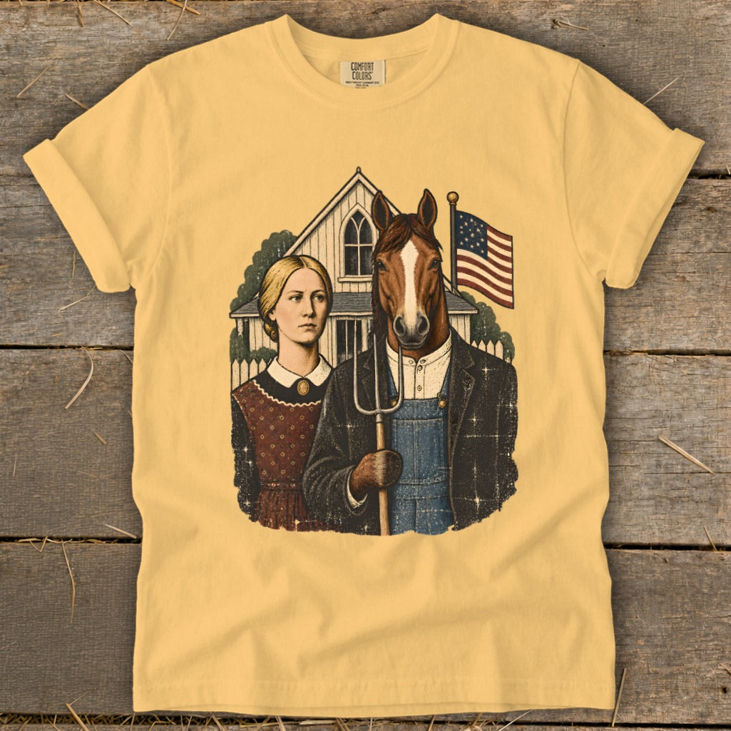 Yellow t-shirt featuring a parody American Gothic graphic with a woman and a horse holding a pitchfork.