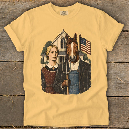Yellow t-shirt featuring a parody American Gothic graphic with a woman and a horse holding a pitchfork.