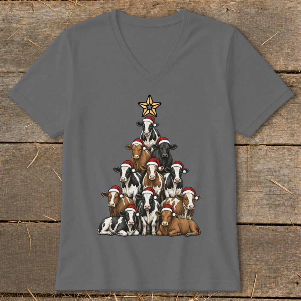 Cows wearing Santa hats arranged in a Christmas tree shape topped with a star.