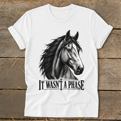 White t-shirt with a black and white drawing of a horse's head and "IT WASN'T A PHASE".