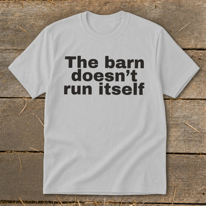 Light gray t-shirt with black text "The barn doesn't run itself."