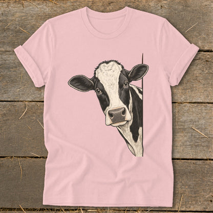 Pink t-shirt with a black and white cow peeking from the side.