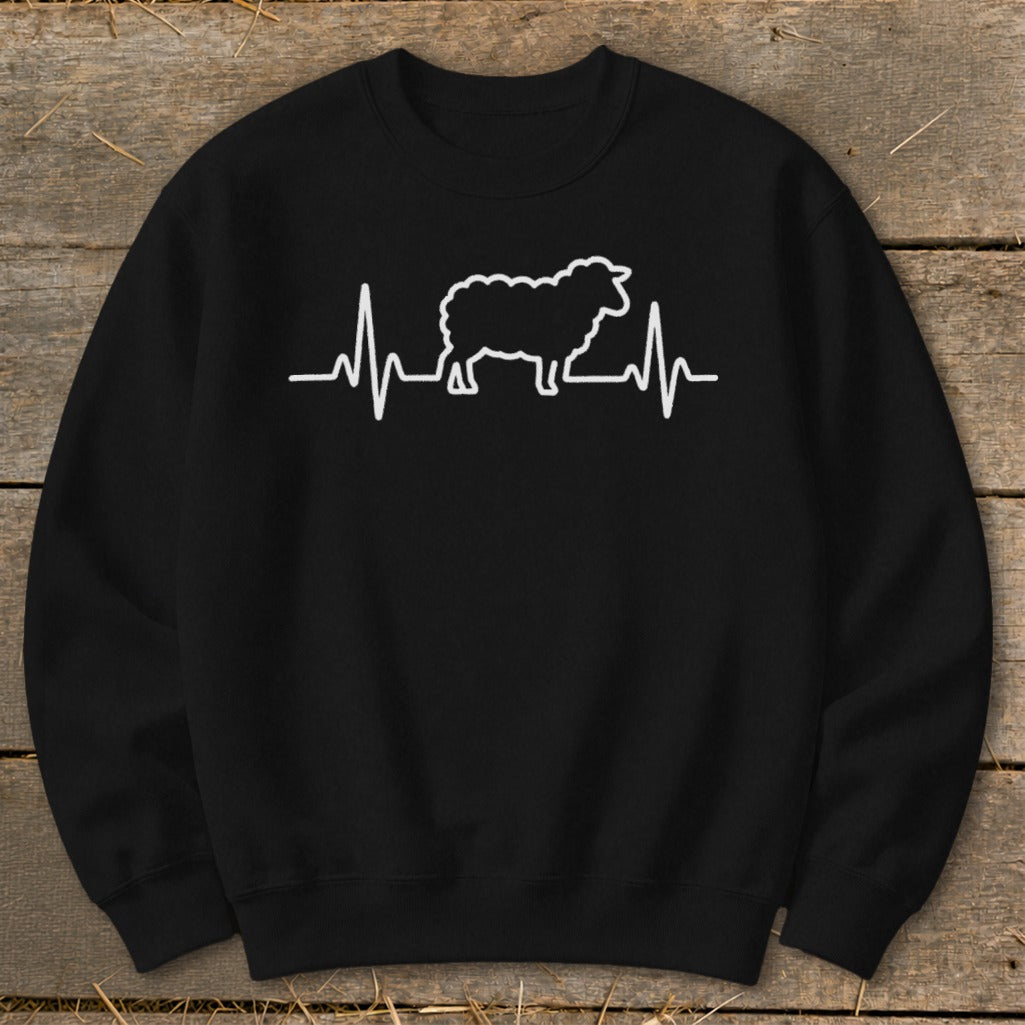 A black crewneck sweatshirt with a white heartbeat line design containing a sheep silhouette in the center.