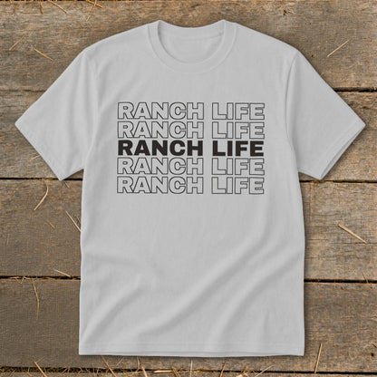 A light grey short-sleeve t-shirt with repeated "RANCH LIFE" text printed centrally on the chest.