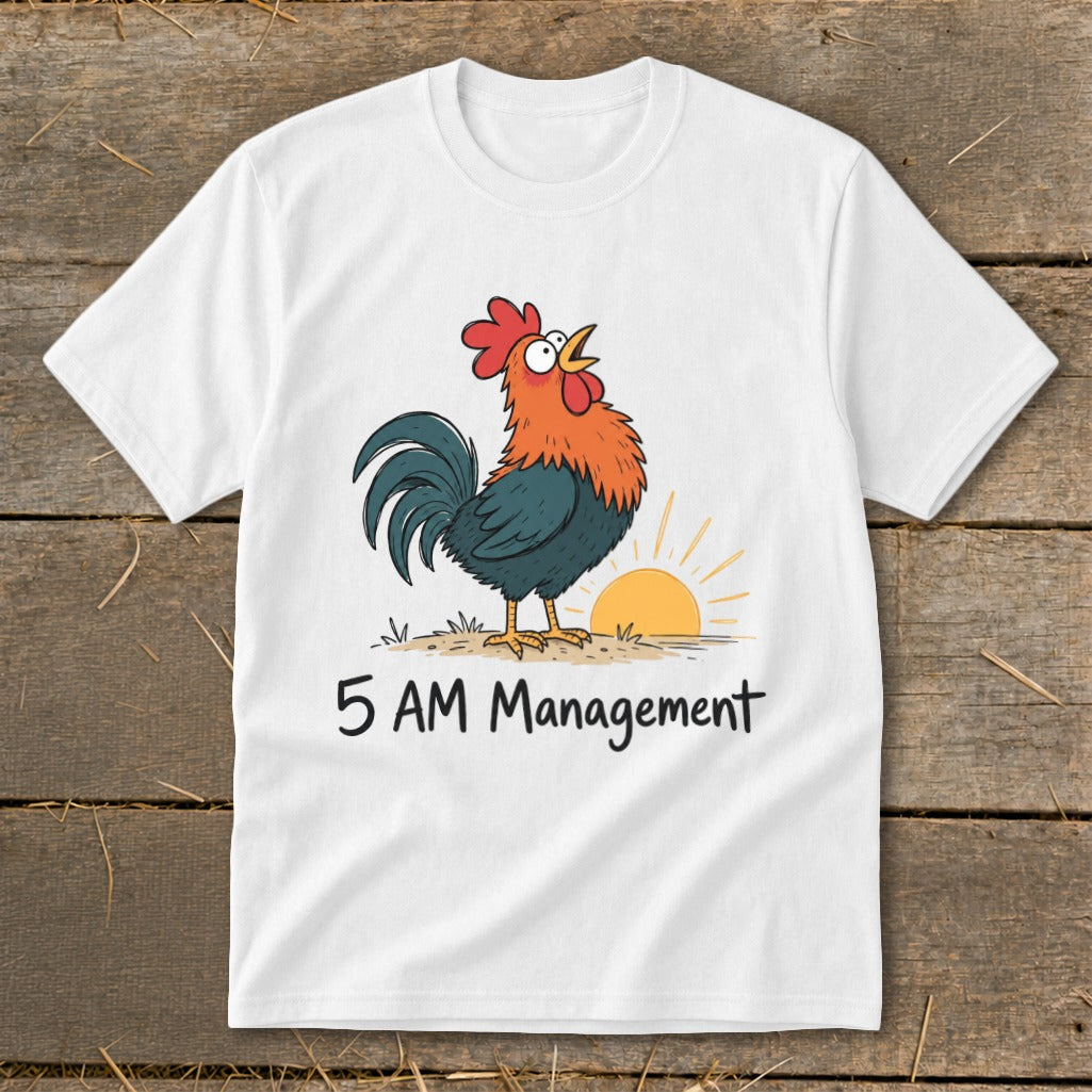 White t-shirt with a cartoon rooster crowing at sunrise and "5 AM Management" text.