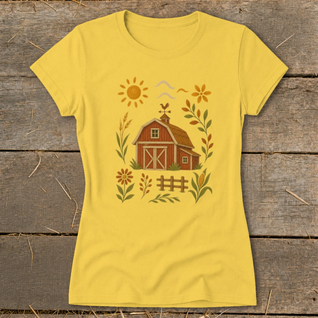 Yellow t-shirt with a rustic barn, sun, flowers, and corn graphic.