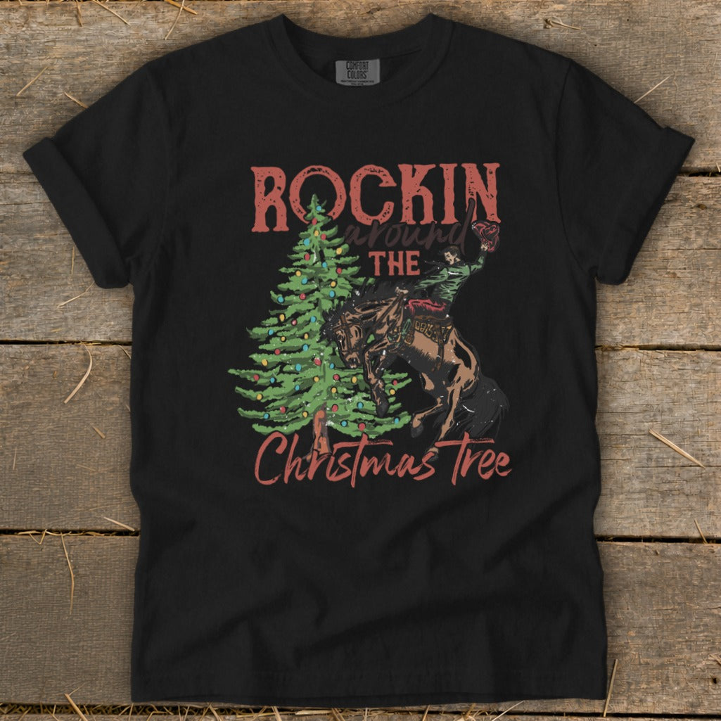 Black t-shirt with "Rockin' Around The Christmas Tree" text and rodeo rider on horse.