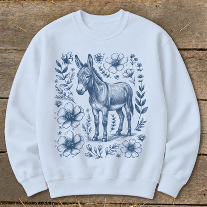 White sweatshirt with a blue sketch of a donkey surrounded by flowers.