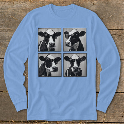 Four black and white cows wearing sunglasses arranged in a grid on a light blue shirt.