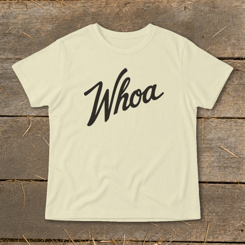 Cream t-shirt with "Whoa" in black script font across the chest.