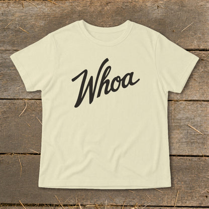 Cream t-shirt with "Whoa" in black script font across the chest.