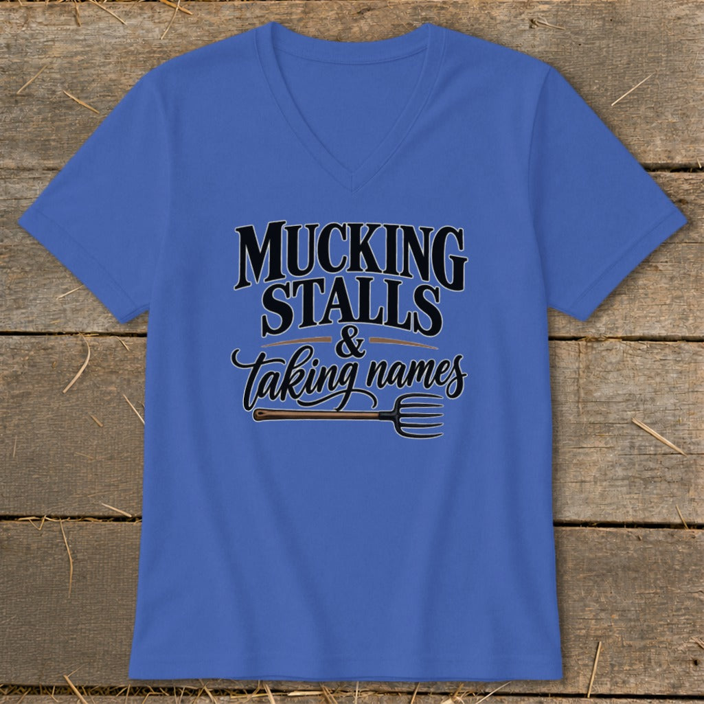 Blue v-neck t-shirt with "Mucking Stalls & Taking Names" text and pitchfork graphic.