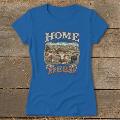 Blue t-shirt with "HOME IS WHERE THE HERD IS" text and a pastoral scene with cows.