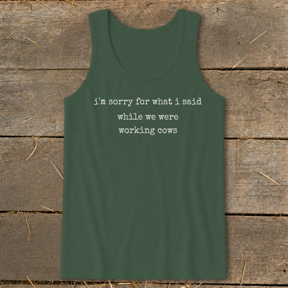 Dark green tank top with white text "i'm sorry for what i said while we were working cows."