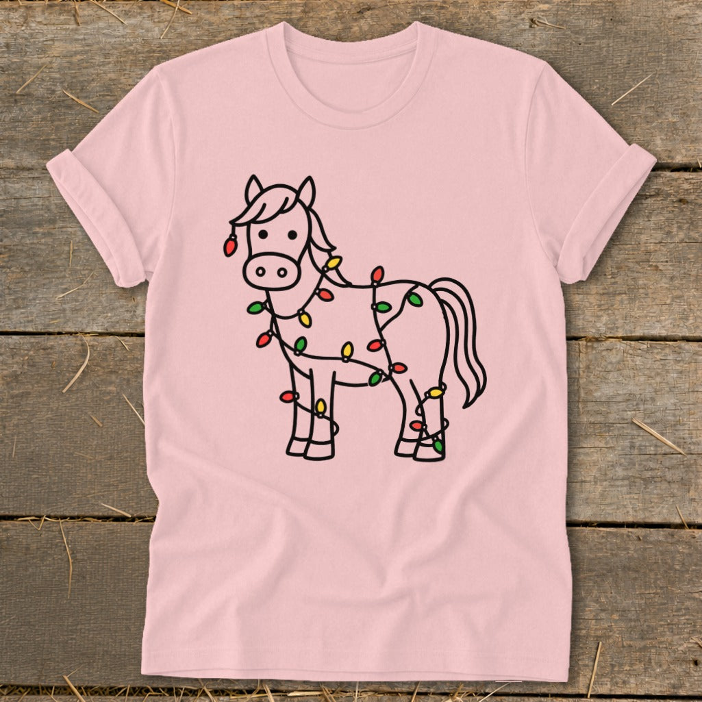 Pink t-shirt with a cartoon horse wrapped in colorful Christmas lights.