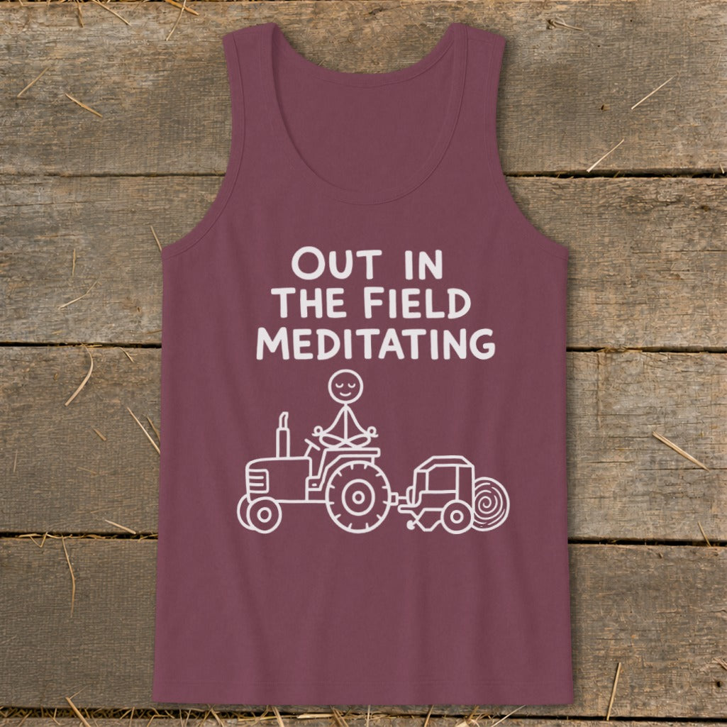 Maroon tank top with "Out in the Field Meditating" text and tractor graphic.