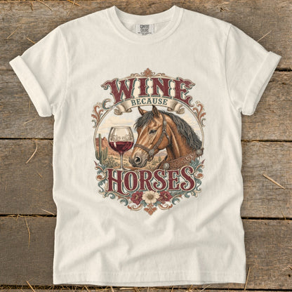 White t-shirt with "Wine Because Horses" graphic featuring a horse, wine glass, and desert scene.
