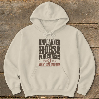 Lightweight beige hoodie with "Unplanned Horse Purchases Are My Love Language" text and horseshoe graphic.