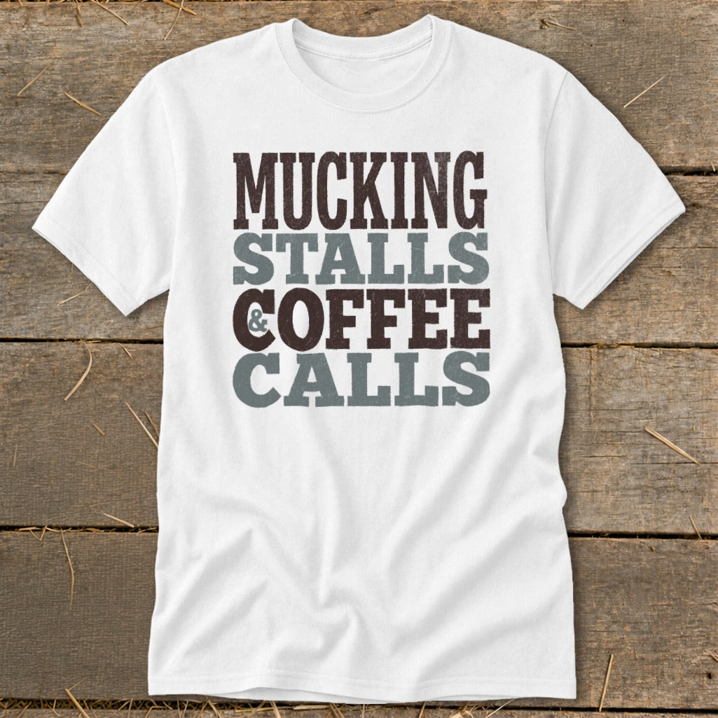 White t-shirt with text: Mucking Stalls & Coffee Calls.