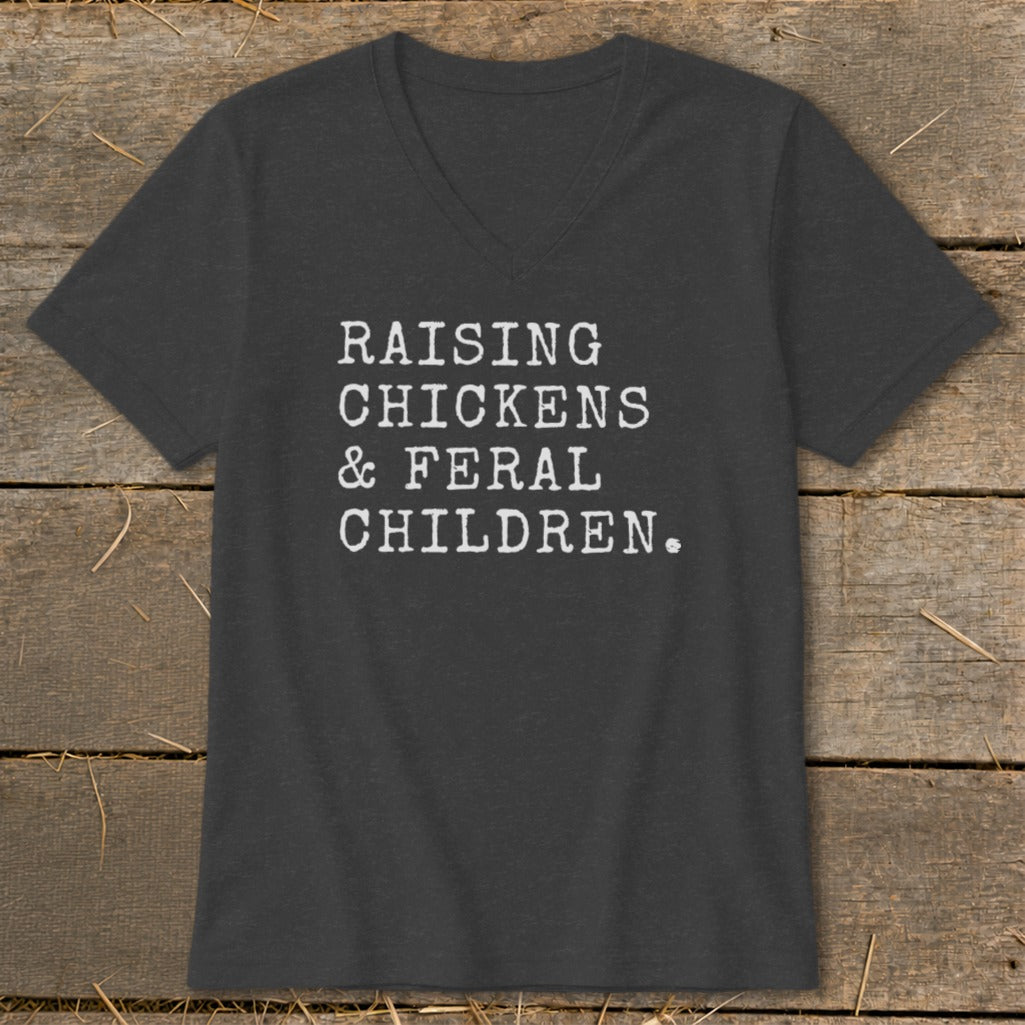 Dark gray v-neck t-shirt with white text: Raising Chickens & Feral Children.