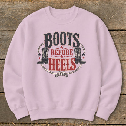 Pink sweatshirt with "Boots Before Heels" text and cowboy boot graphics.