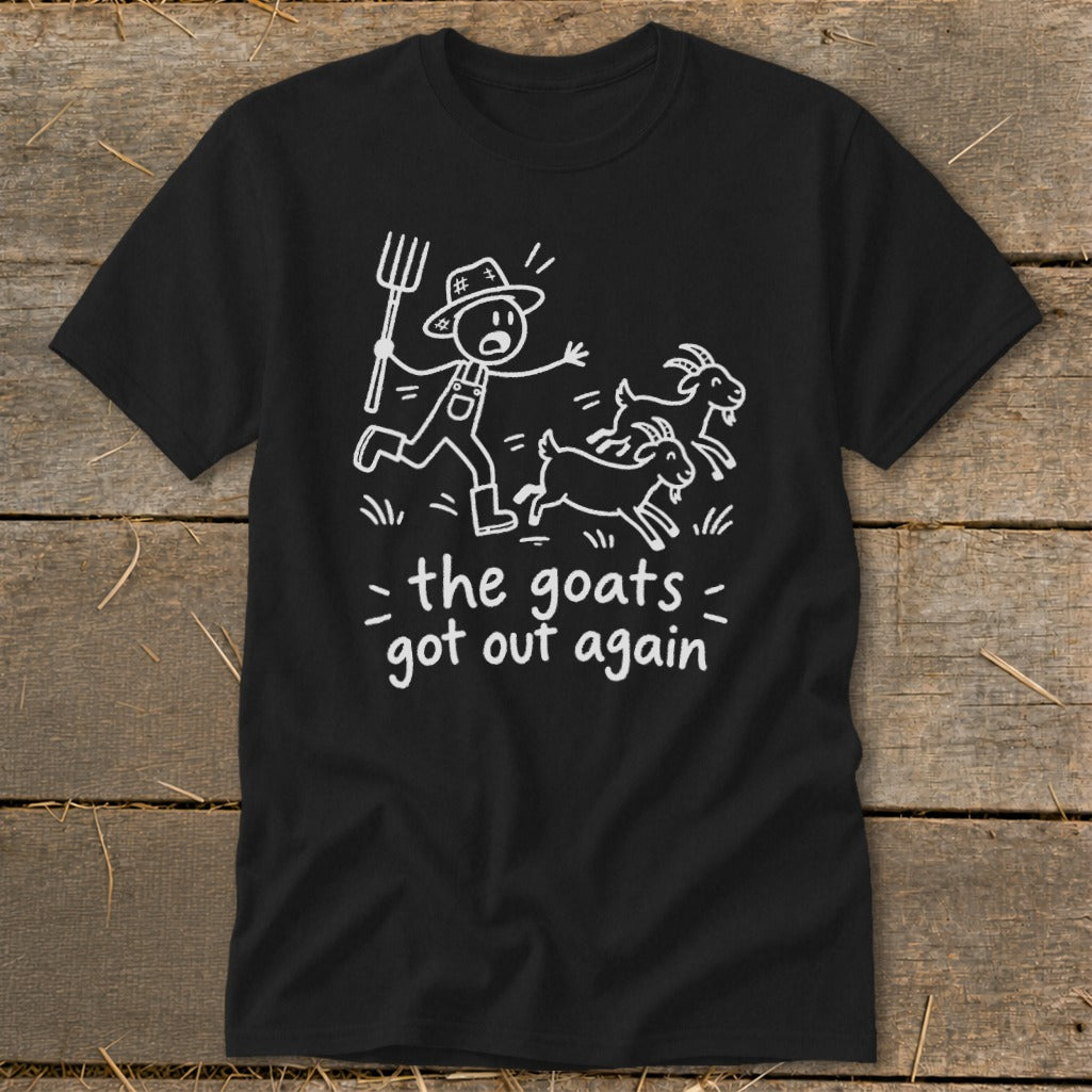 Black t-shirt with white cartoon of farmer chasing escaped goats and text "the goats got out again."