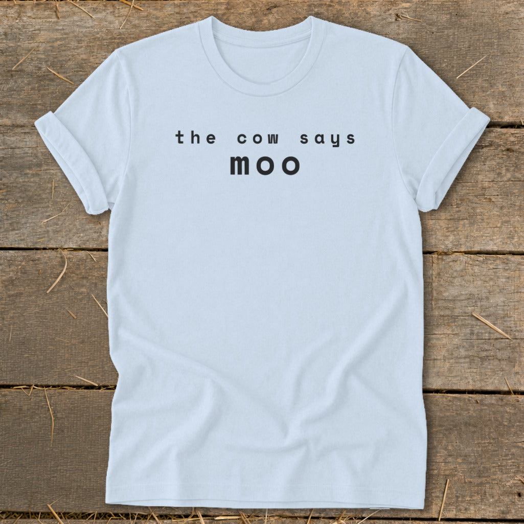 Light blue t-shirt with black text "the cow says moo".